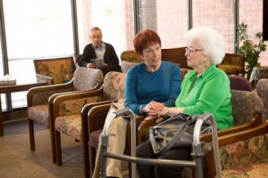 Family-caregiver-with-senior_clinic-waiting-room